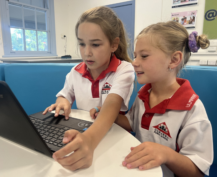 students working together on laptop