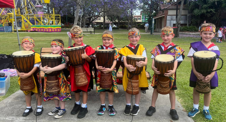 student drumming group